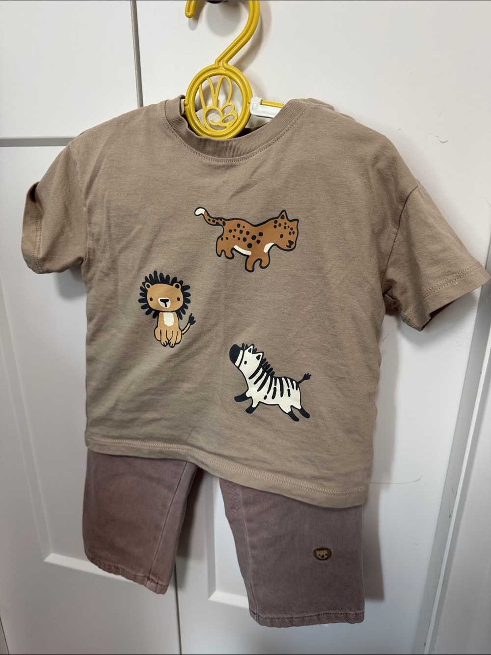 H&M Taupe Short Sleeve Tee with Safari Animal Graphics with jeans